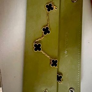 Van Cleef & Arpels Alhambra 5 motif bracelet in black onyx and yellow gold